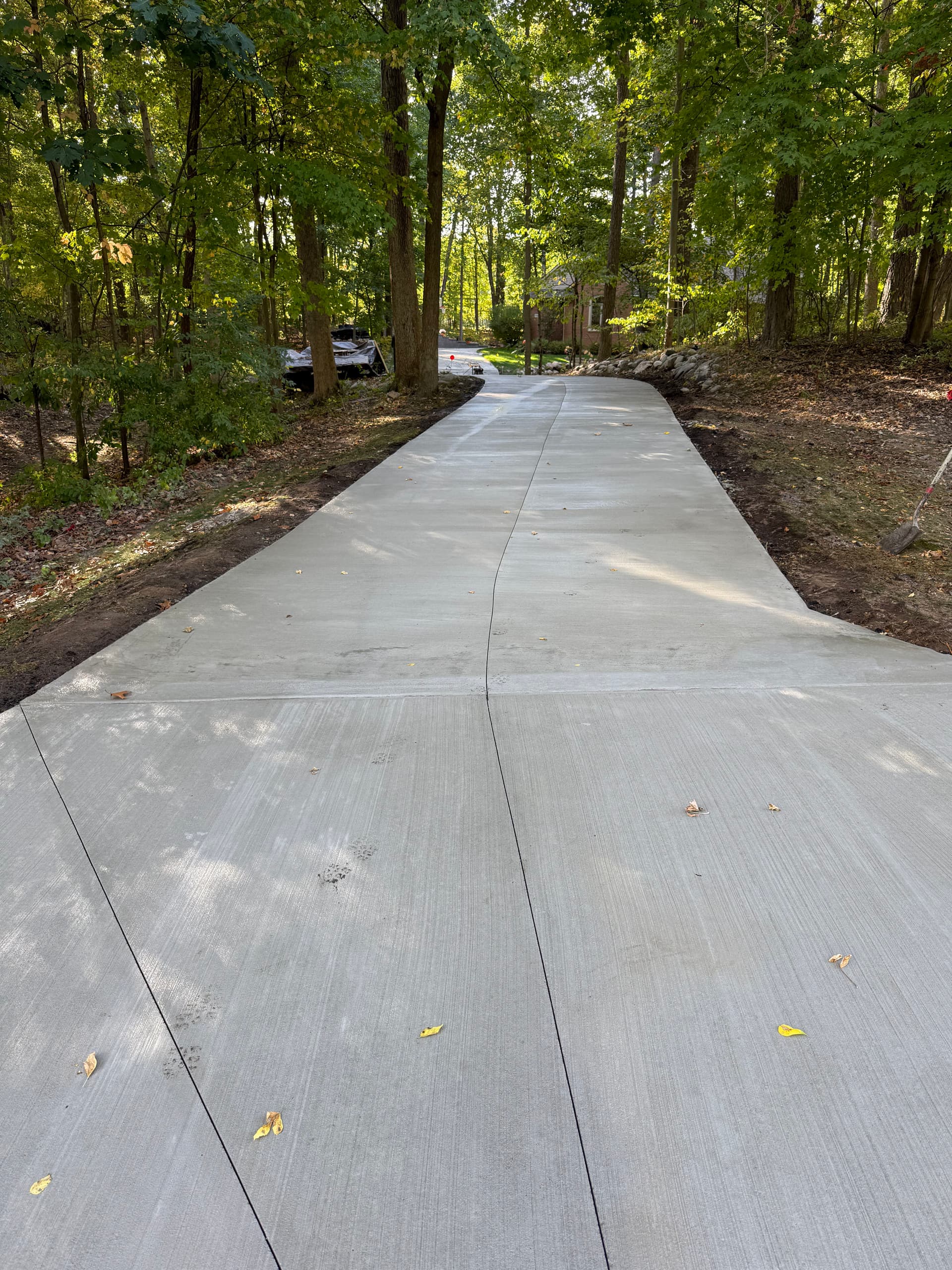 Gallery photos for Smooth New Concrete Driveway Installed in Scenic Woodland: Image #1