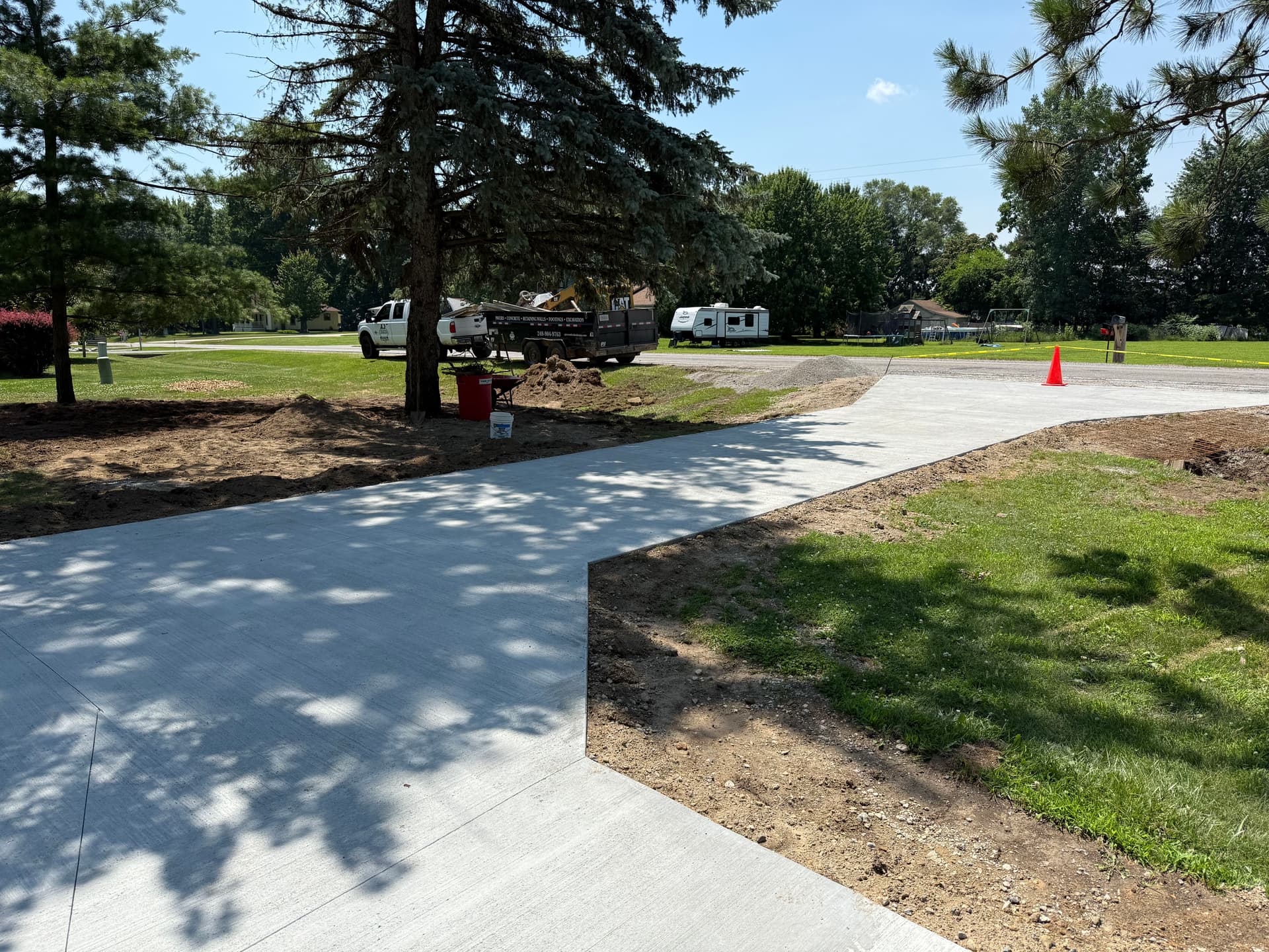 Concrete Driveway and Paver Walkway Transformation