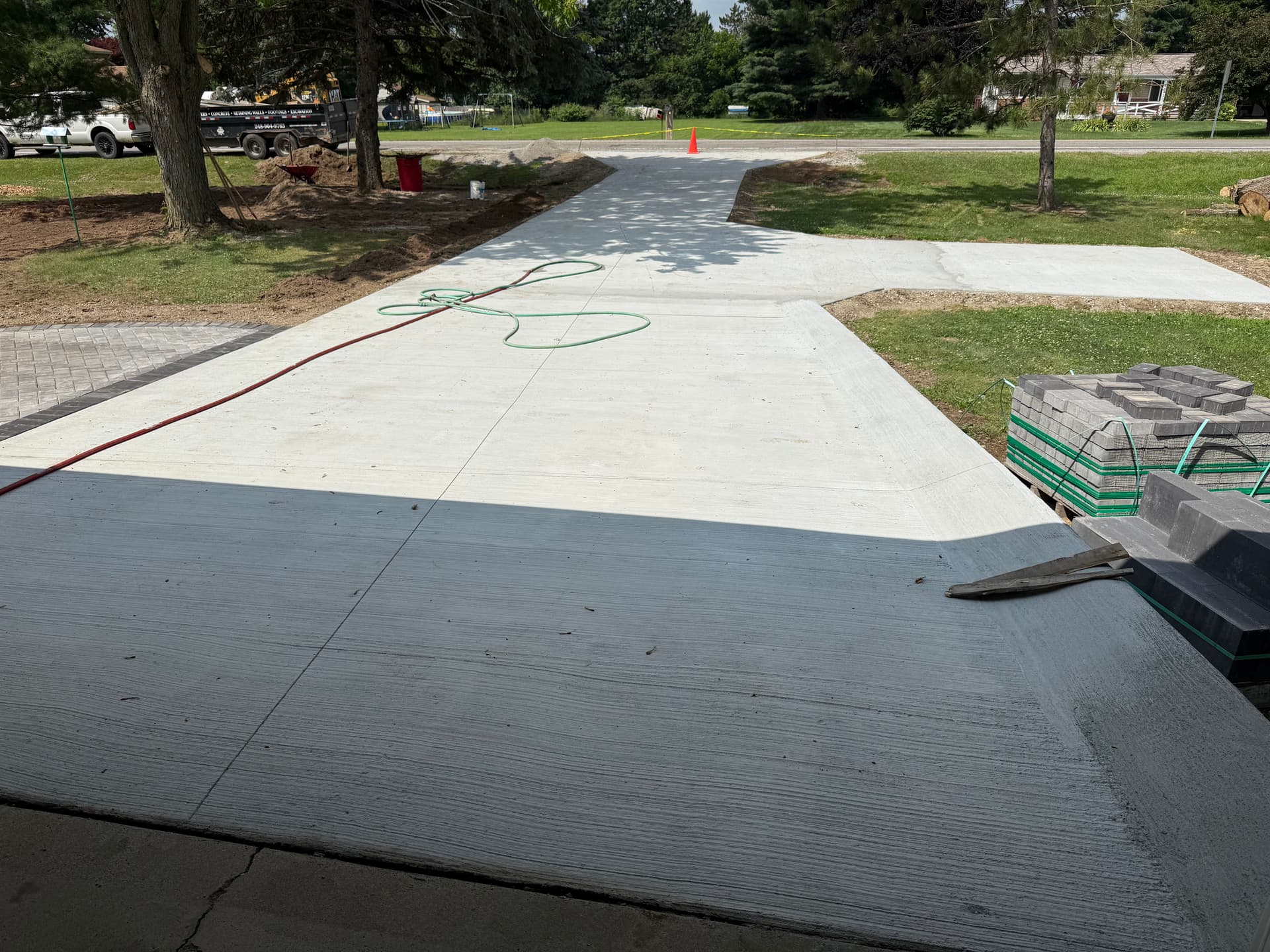 Concrete Driveway and Paver Walkway Transformation